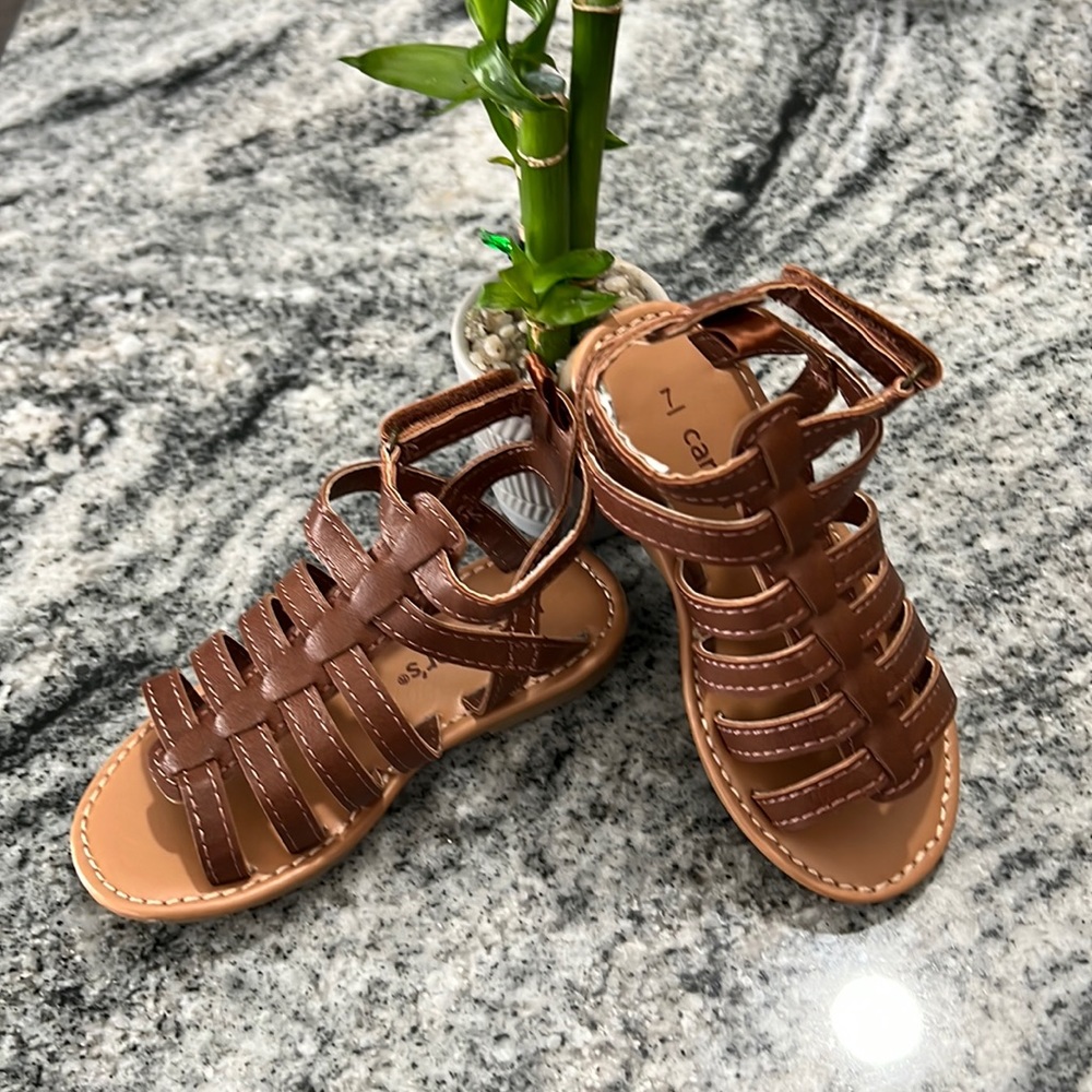 Carters New baby girl sandals.  Adorable. No tags never worn Sz 7